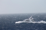 The yacht was designed to function not just as a floating palace but as a seagoing vessel--and as it crossed the Atlantic a few weeks ago, it was clobbered by a violent storm. These photos were taken by a passing freighter.  Photo: ©Patty Witler Anderson.