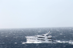 The yacht was designed to function not just as a floating palace but as a seagoing vessel--and as it crossed the Atlantic a few weeks ago, it was clobbered by a violent storm. These photos were taken by a passing freighter.  Photo: ©Patty Witler Anderson.