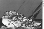 <em>Sayonara’s</em> crew sit on the rail as wind strengthens.