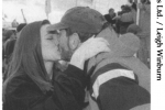 Larry Ellison kisses his girlfriend, Melanie Craft, in Hobart.